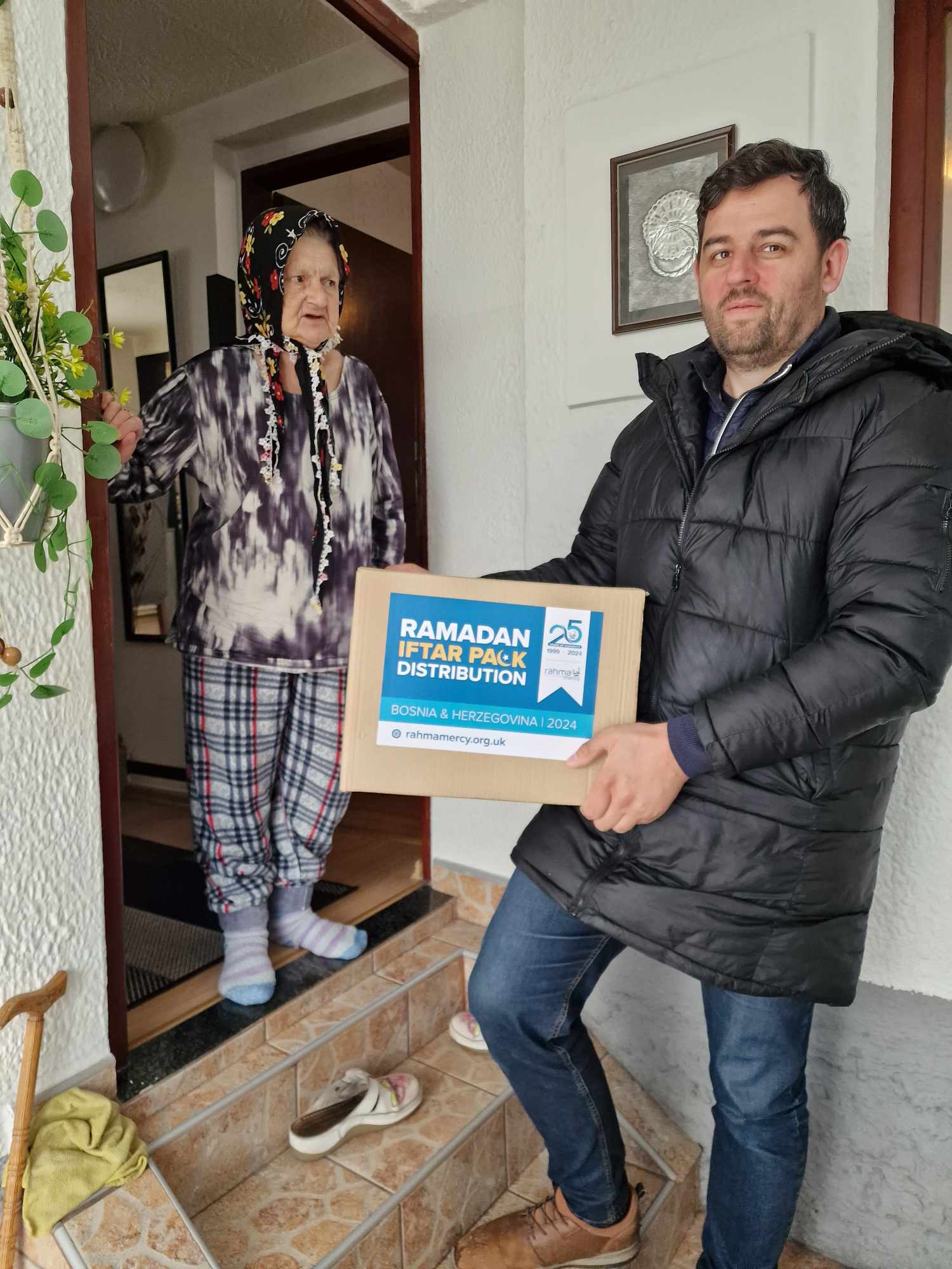 A family receiving their winter parcel